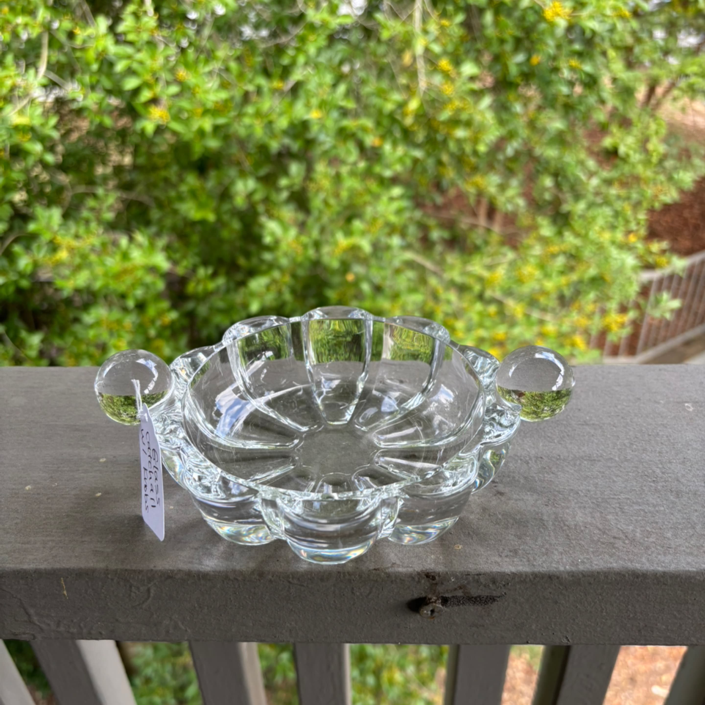 Thick glass dish with ball handles